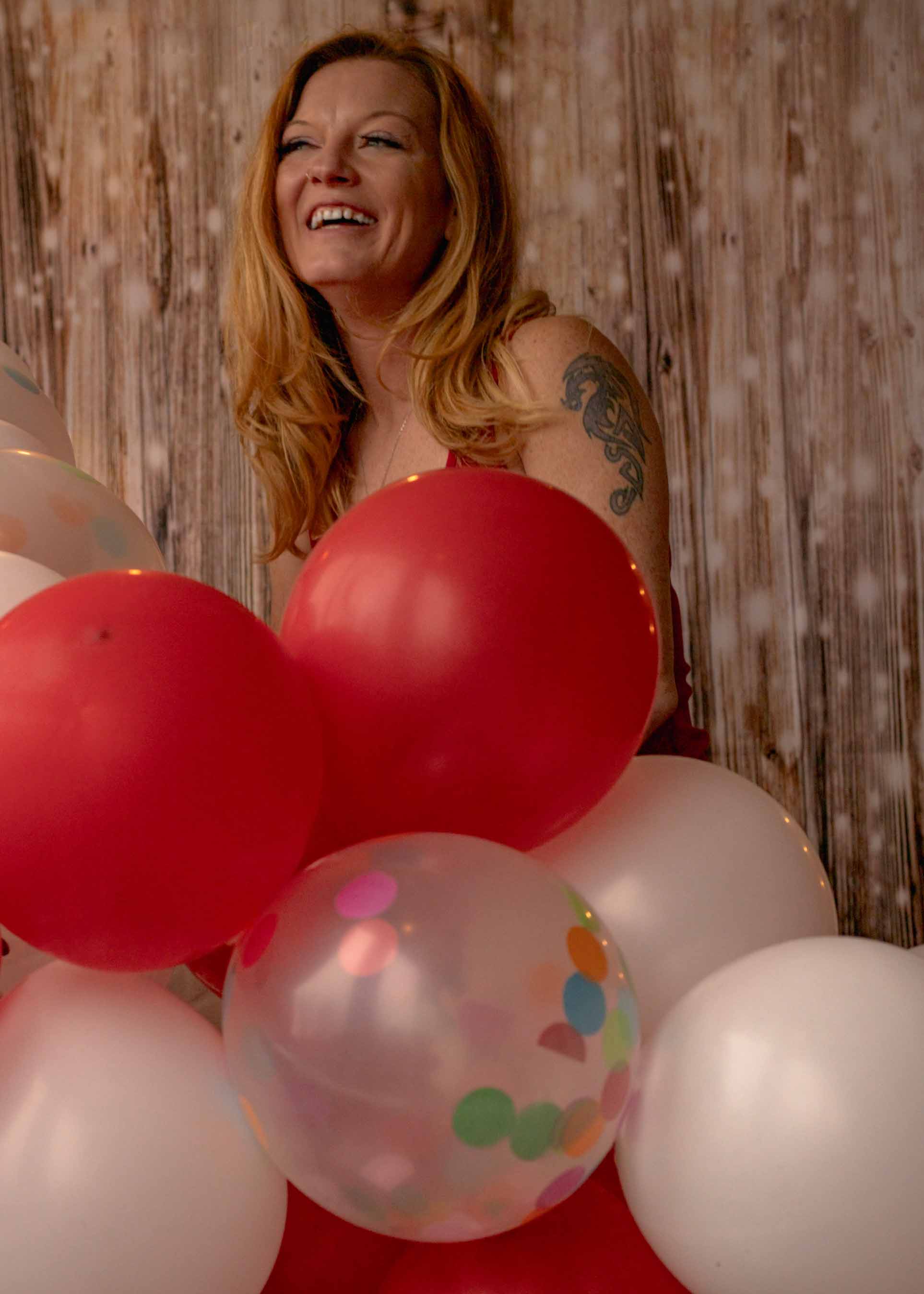 event photography surprise birthday party balloons Excited woman