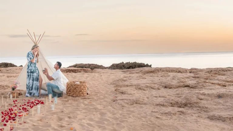 Surprise proposal by oahu proposal photographer, LT² Photography. Man proposes on the beach as his fiancée reacts with emotion during a custom-tailored LT² Grand Gestures Experience in Hawaii.